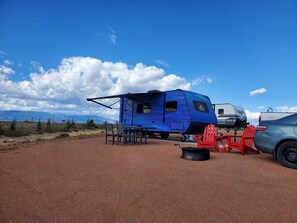 Outdoor dining - Neptune Camper Suite - Planet-themed camper suite with awning deck, sleeps three (Penrose)