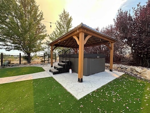A wooden gazebo with steps leading up to a storage shed. - Reno Retreat - 3BR Oasis w Swim Spa, Hot Tub (Reno)