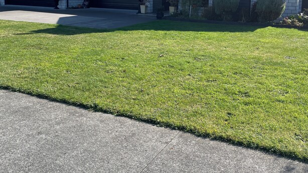 A modern two-story house with a garage, a covered porch, and a well-maintained lawn. - Clean, warm and beautiful place to stay only 4 minutes to Cambridge. (Cambridge)