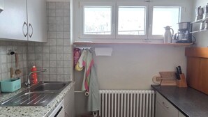 A compact kitchen with a sink, countertop, and a window above the radiator. - Casa Fasciati Appartement/Fewo, Bad, WC, 4 oder mehr Schlafräume by Interhome (Bivio)