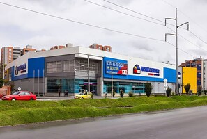 A modern building with large windows and a sign that reads 'ESTA ES TU CASA MI SUELECCION'. - Perfect 2-bedroom apartment in gorgeous Bogotá D.C. neighborhood (Bogotá, D.C.)