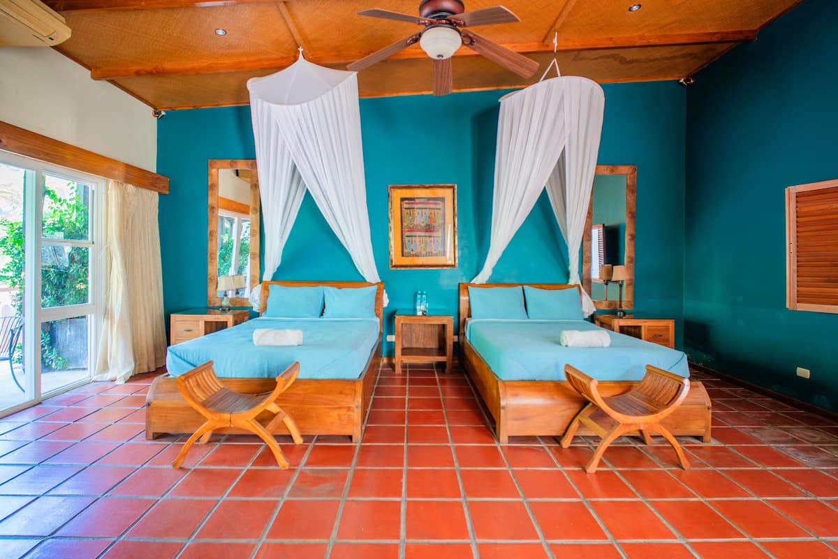 Deluxe Suite, Patio, Garden View | In-room safe, desk, laptop workspace, free WiFi