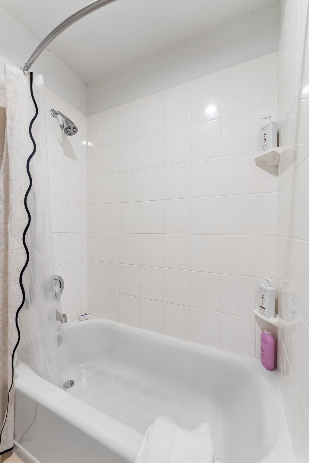 Shower, hair dryer, towels, shampoo
