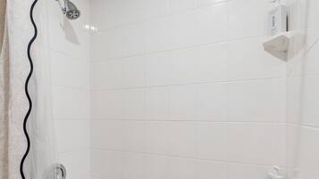 Shower, hair dryer, towels, shampoo