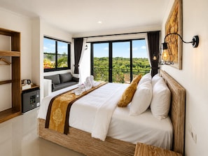 A hotel room with a large bed, a seating area with a view, and a balcony. - Penida Cabins (Penida Island)
