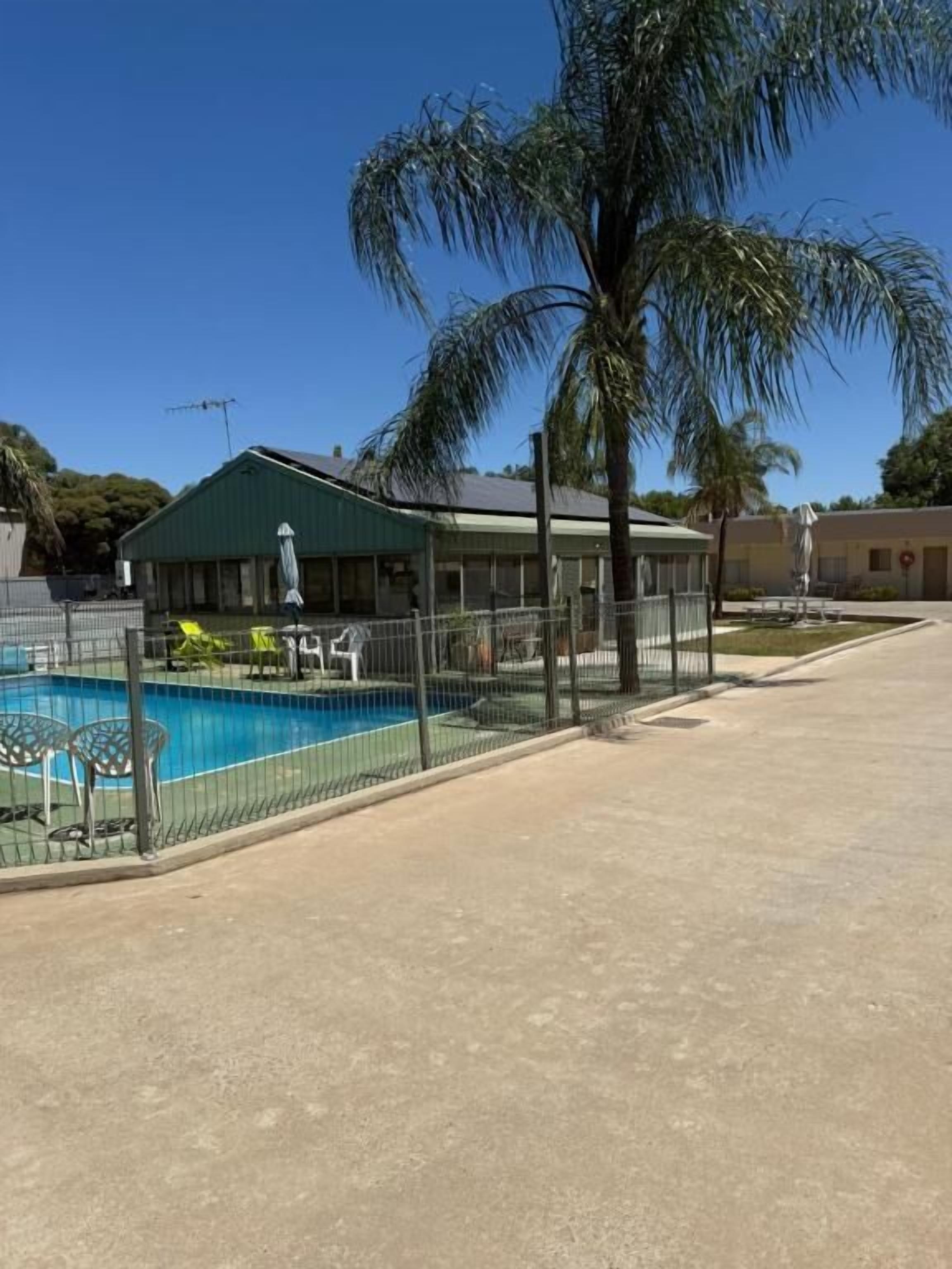 Outdoor pool, open 7:00 AM to 10:00 PM, pool umbrellas, pool loungers