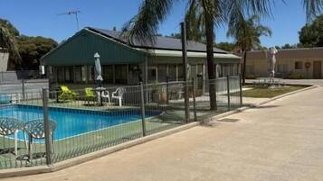 Outdoor pool, open 7:00 AM to 10:00 PM, pool umbrellas, pool loungers