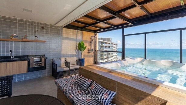 A modern interior with a kitchen, seating area, and a hot tub overlooking the sea. - Ap With Jacuzzi and sea View in Ilheus, BA Cdw0102 (Ilhéus)