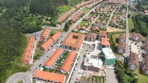 An aerial view of a residential area with multiple buildings, roads, and green spaces. - Villa Carinn Sella - Ribadesella - Beach 2 km away (Ribadesella)