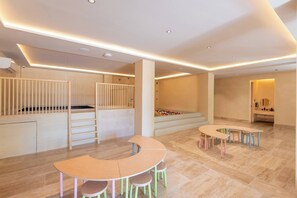 A children's play area with a climbing structure, a ball pit, and a table with chairs. - Stylish 1BR Condo with Resort Amenities (Playa del Carmen)