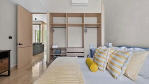 A modern bedroom with a bed, wardrobe, and built-in storage. - Spacious 2BR with Terrace in The Village (Playa del Carmen)