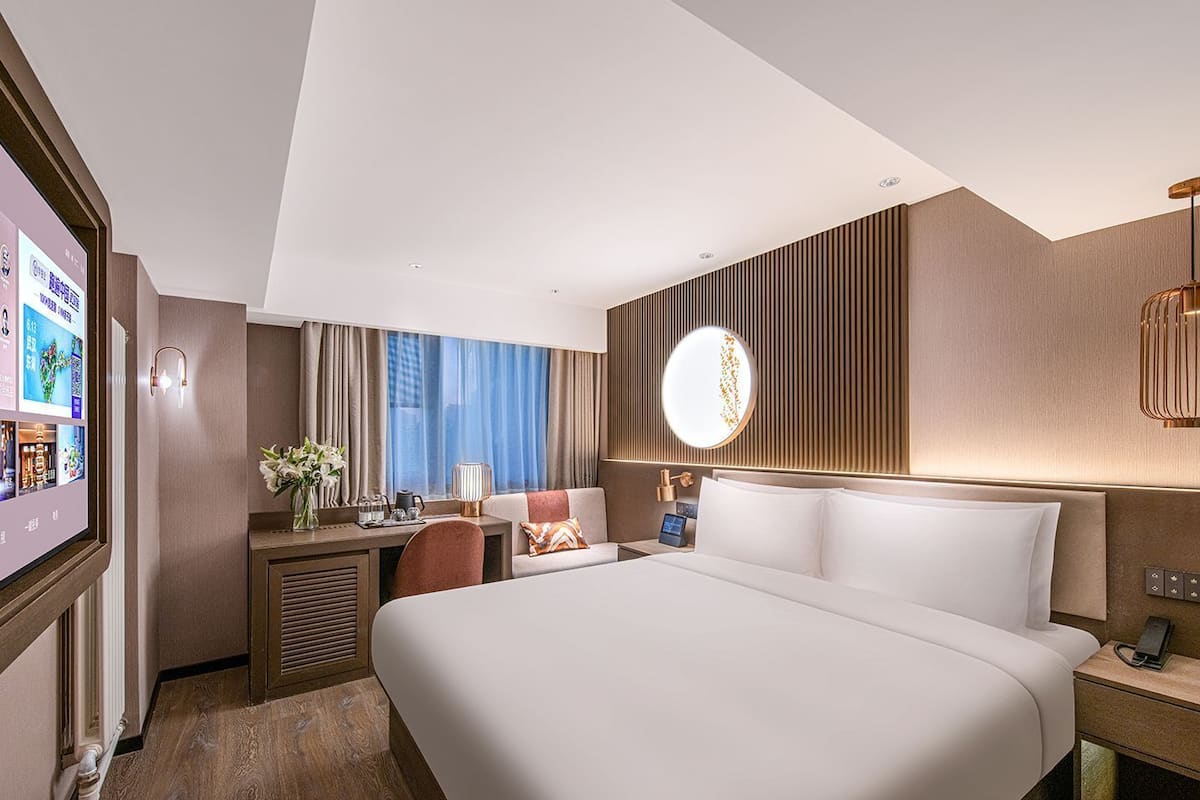 Habitación empresarial doble | Edredón, camas con efecto memoria y artículos del minibar gratis