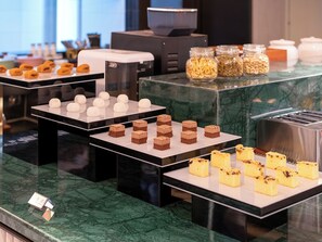 A buffet with various desserts and food items. - Crystal Hotel Beijing TianTan (Beijing)