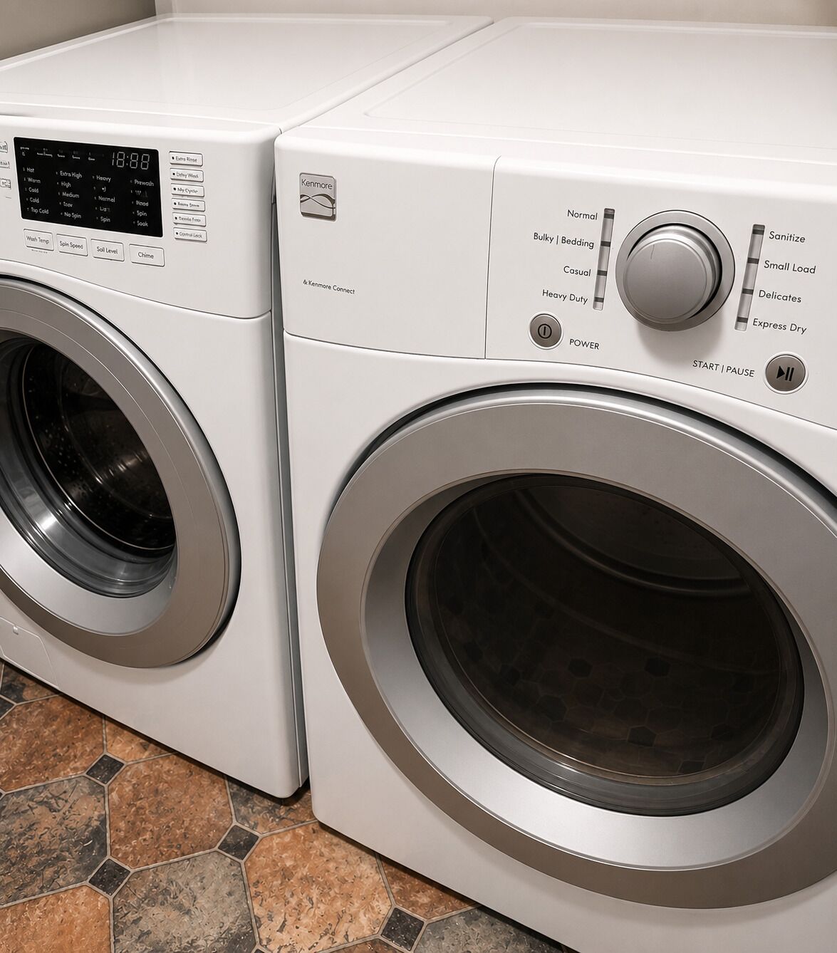 A front view of a Kenmore front-loading washer and dryer set.