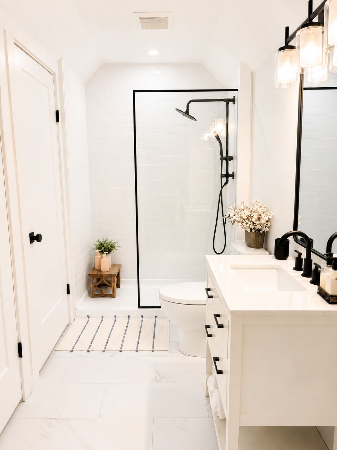 A modern bathroom with a shower, toilet, and vanity.