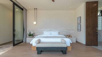 A modern bedroom with a large bed, a bedside table, a nightstand, a wall-mounted light, and a large window.