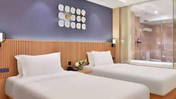 Premium bedding, down comforters, minibar (free items), desk