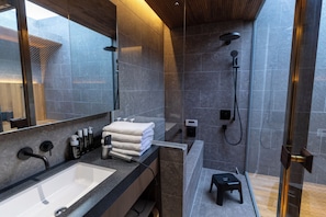 A modern bathroom with a large mirror, a sink, and a shower area. - ALMOND HOTEL SHIBUYA F (Shibuya-ku)