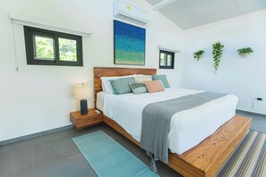 A modern bedroom with a wooden bed, a nightstand, a wall-mounted air conditioner, and a window.