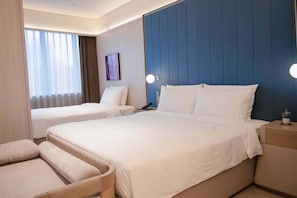 A hotel room with two beds, a seating area, and a view of the outside through the window. - Crystal Hotel BJ Lize Biz Dis Center (Beijing)