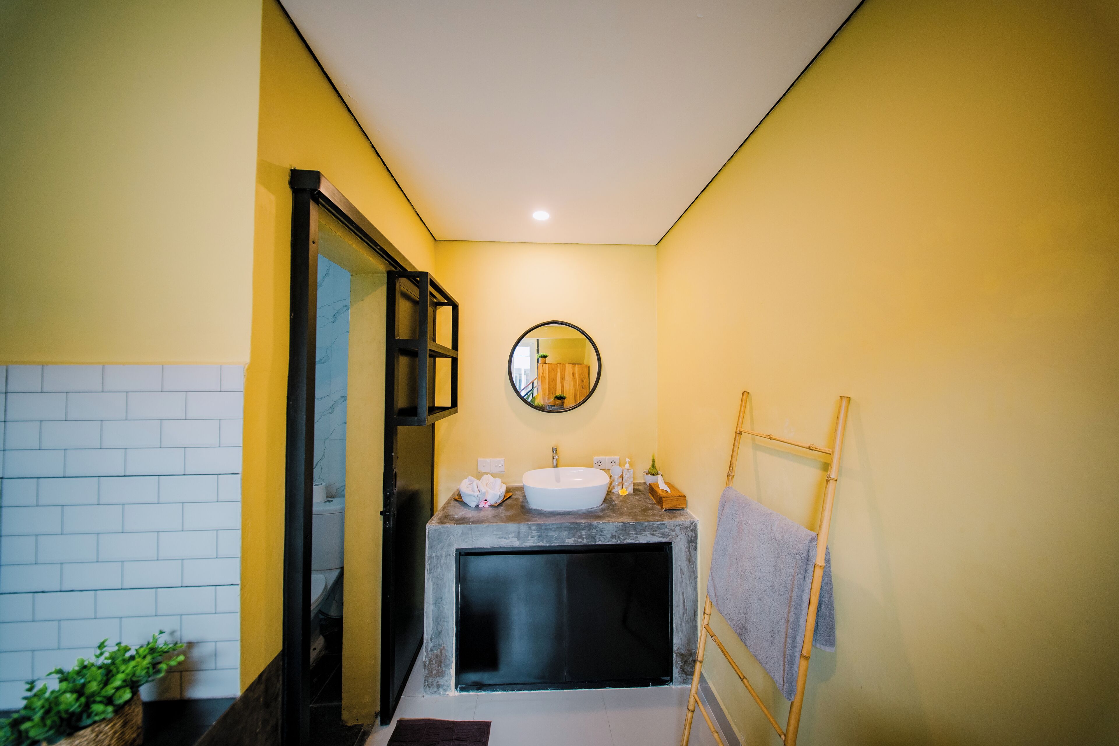 A bathroom with a bathtub, a sink, and a mirror.
