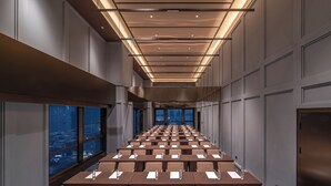 A conference room with rows of tables, large windows, and a modern ceiling design. - Crystal Orange Tianjin Eye Ancient Culture Street (Tianjin)
