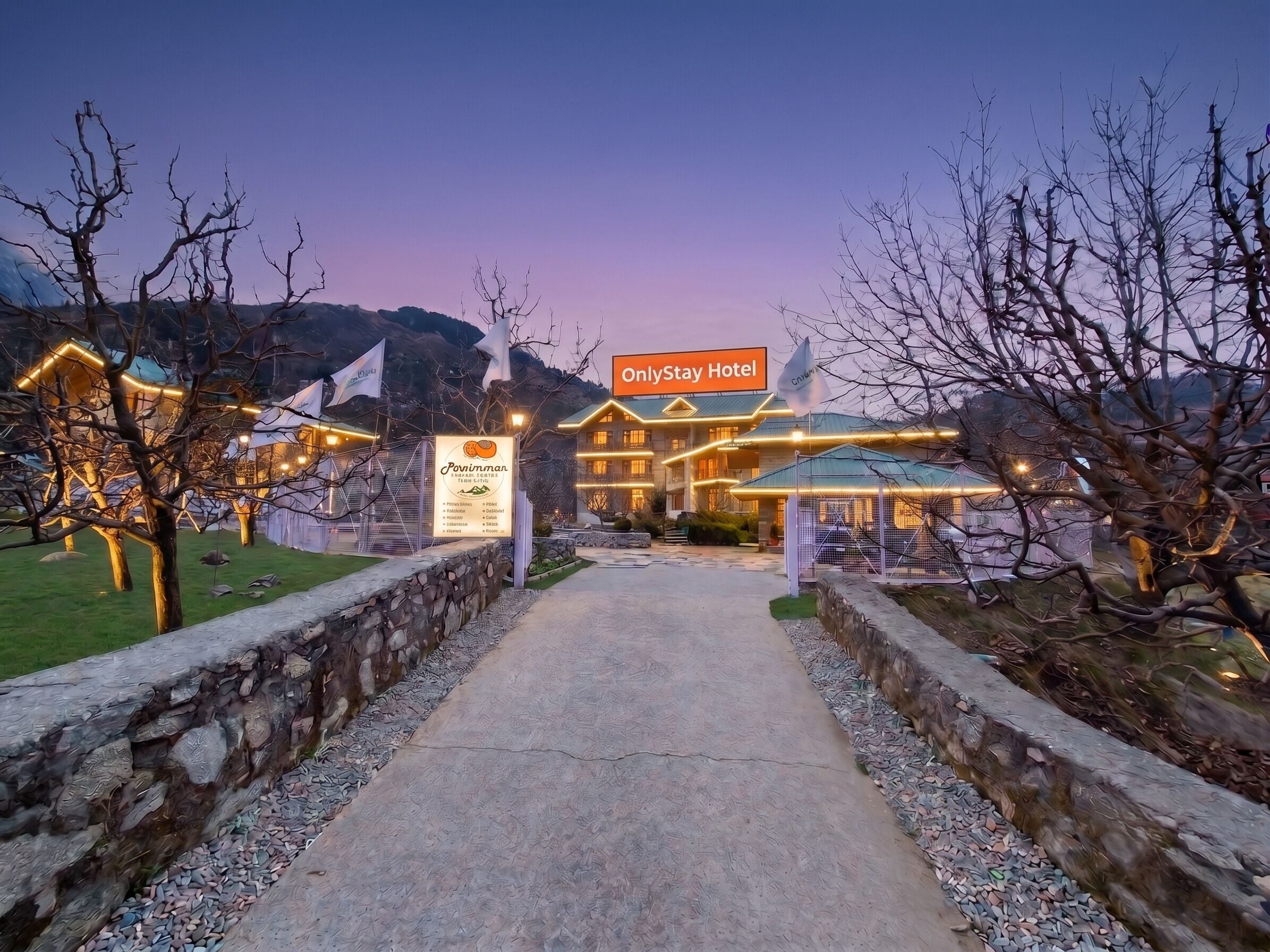 A hotel entrance with a sign for 'OnlyStay Hotel' and a sign for 'Povinnman Resort'.