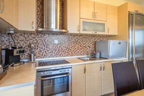 A modern kitchen with stainless steel appliances, a microwave, and a built-in oven.