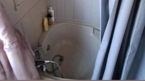 A bathroom with a bathtub, a shower, and a toilet.