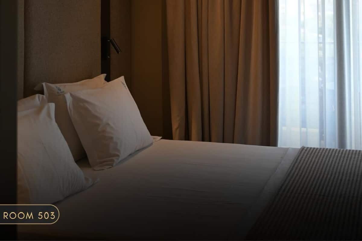 Habitación triple clásica, vista parcial al mar | Wifi gratis