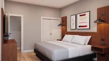 Un dormitorio moderno con una cama grande, un armario, una mesita de noche y un televisor montado en la pared.