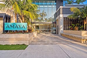 A modern building entrance with a sign reading 'AMAYA'.