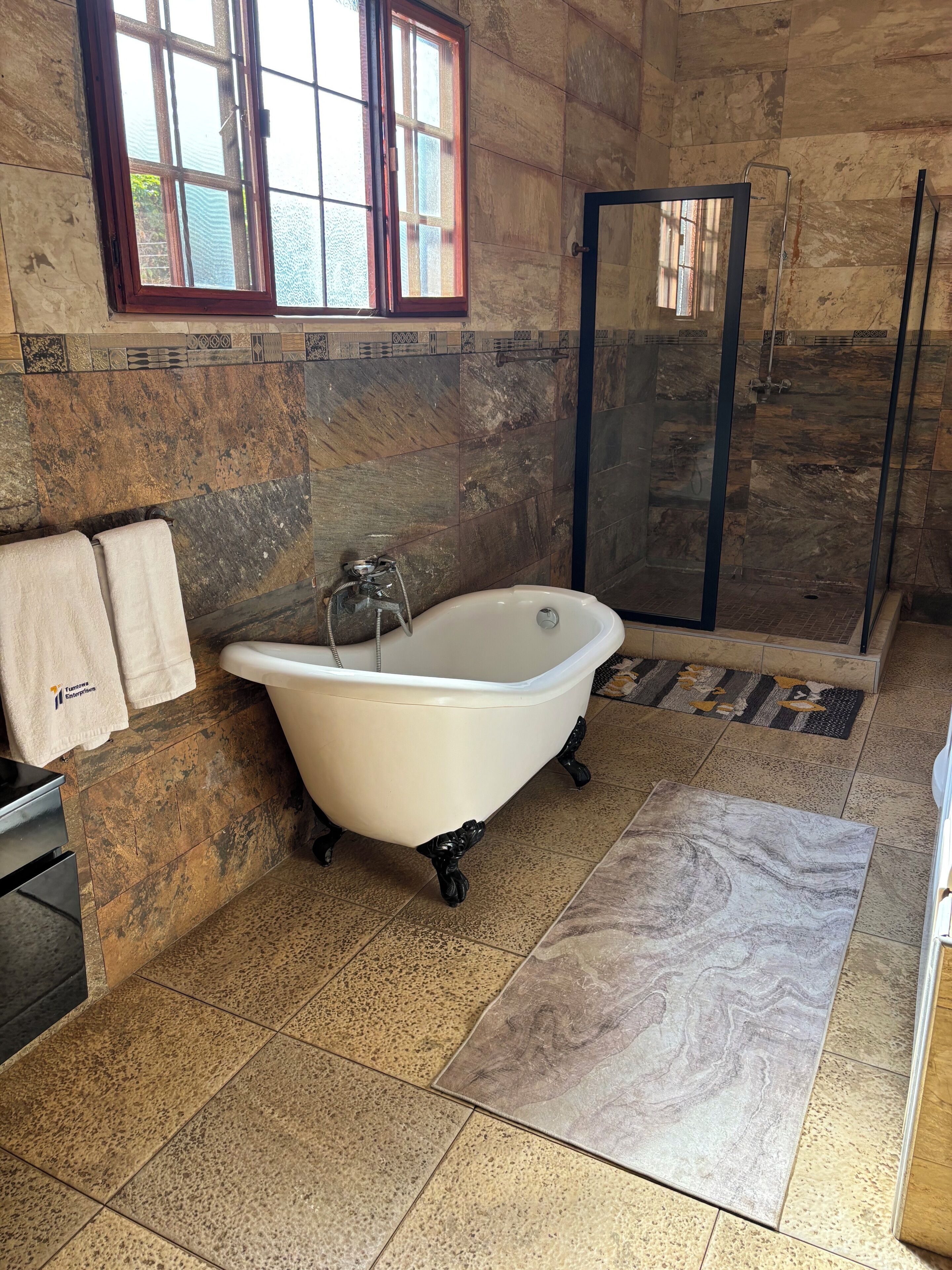 Jetted tub, hair dryer, towels, soap