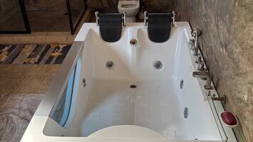 Jetted tub, hair dryer, towels, soap
