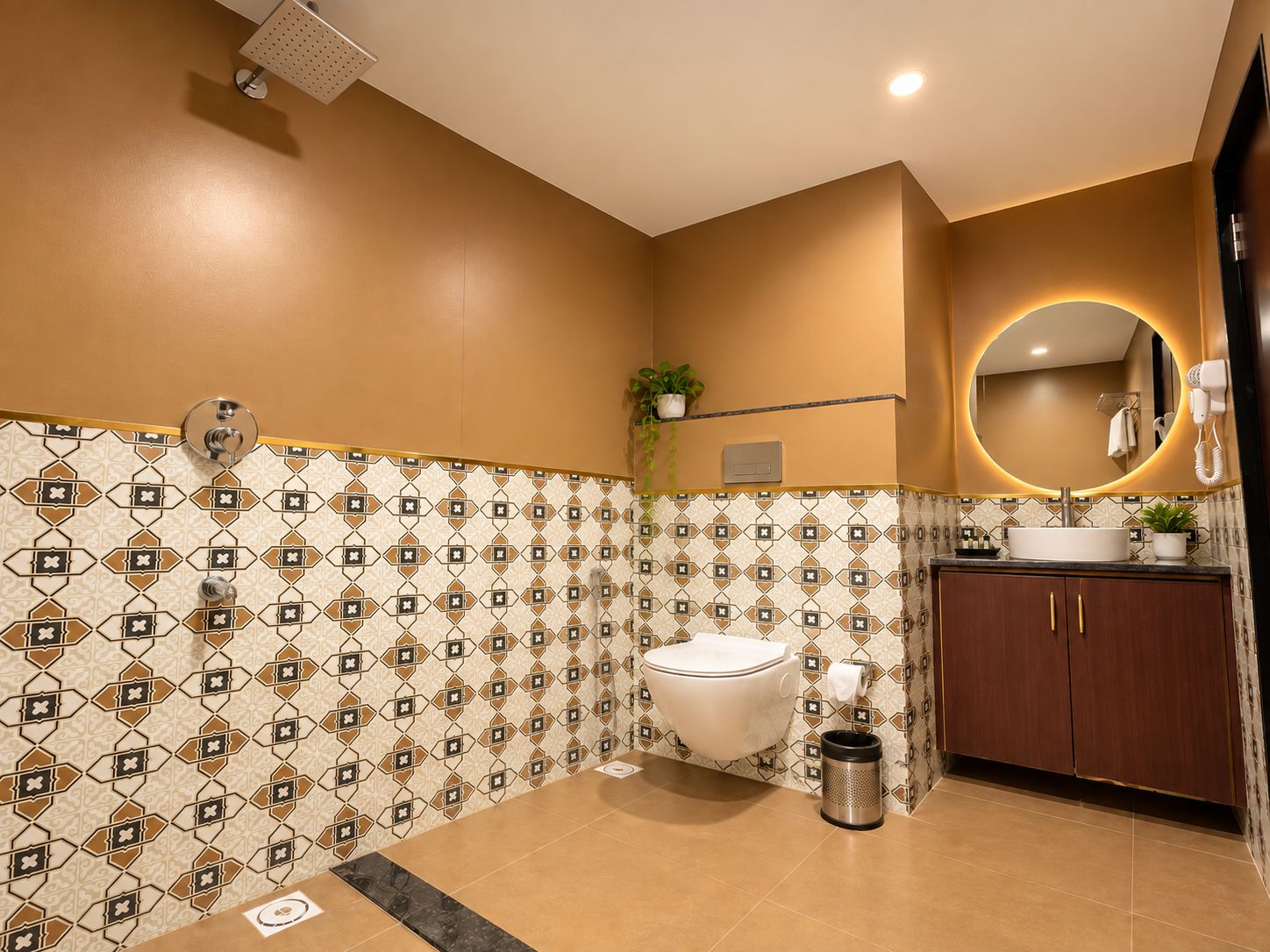 A bathroom with a toilet, sink, mirror, and shower.