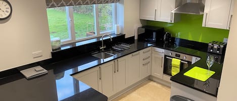 Coffee/tea maker, fridge, microwave, oven