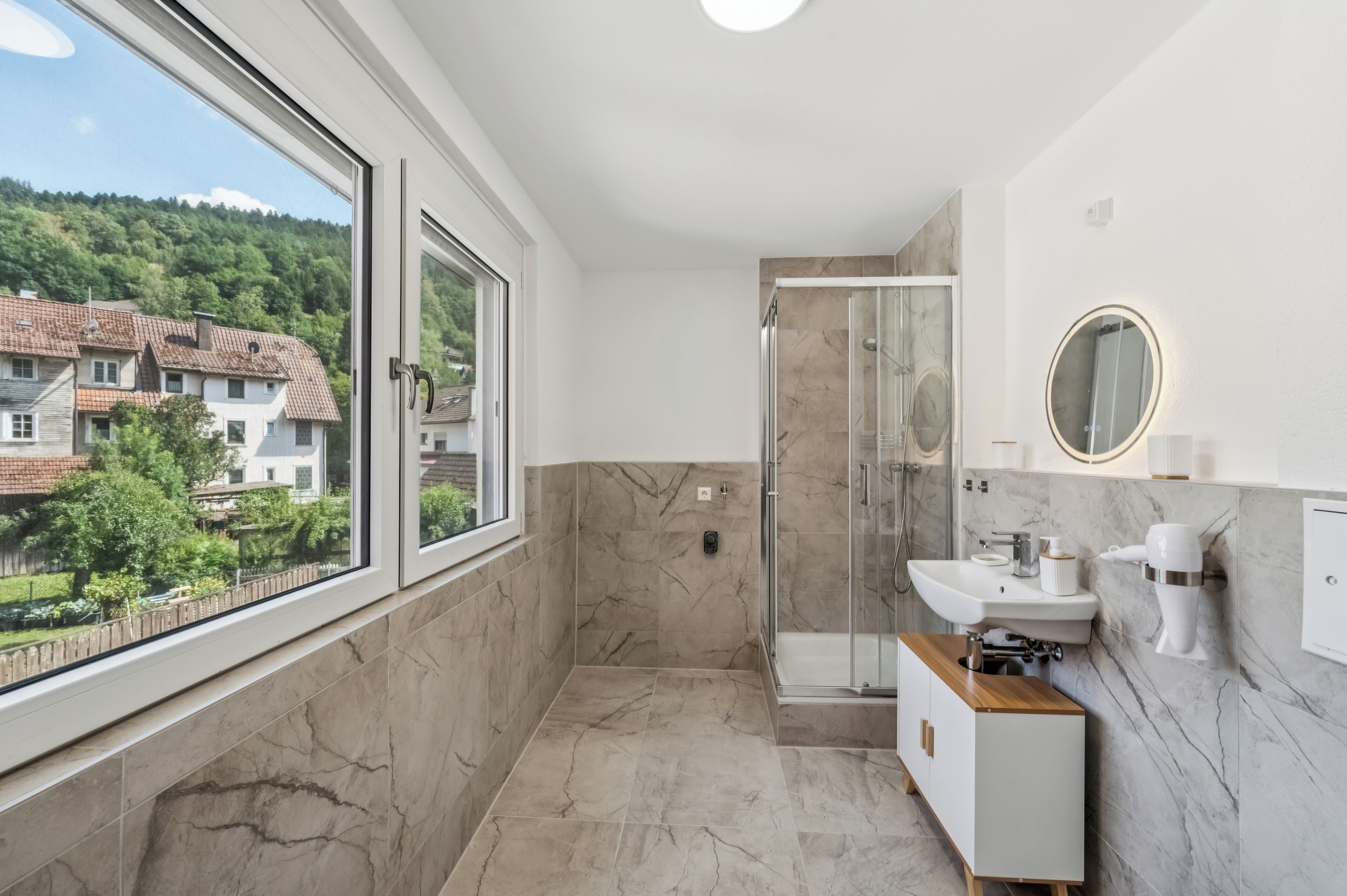 Shower, hair dryer, towels, soap