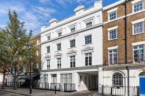 A historic building with the name 'Marquis of Clanricarde' on the facade, featuring classical architecture with symmetrical windows and a brick facade. - Hyde Park Premium Apartments (London)