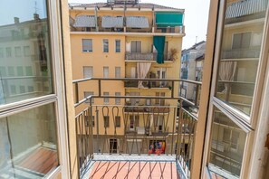 A multi-story building with balconies, a tiled floor, and a metal railing. - A bright and comfortable 48 square meters apartment, perfect for three people, located on the third floor of a renovated building with an elevator (NOT accessible to people with disabilities).The property is situated in an extremely quiet area well-serve (Turin)