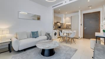 Deluxe Apartment, 1 Bedroom, Balcony, City View | Living area | 43-inch Smart TV with digital channels, Netflix, streaming services