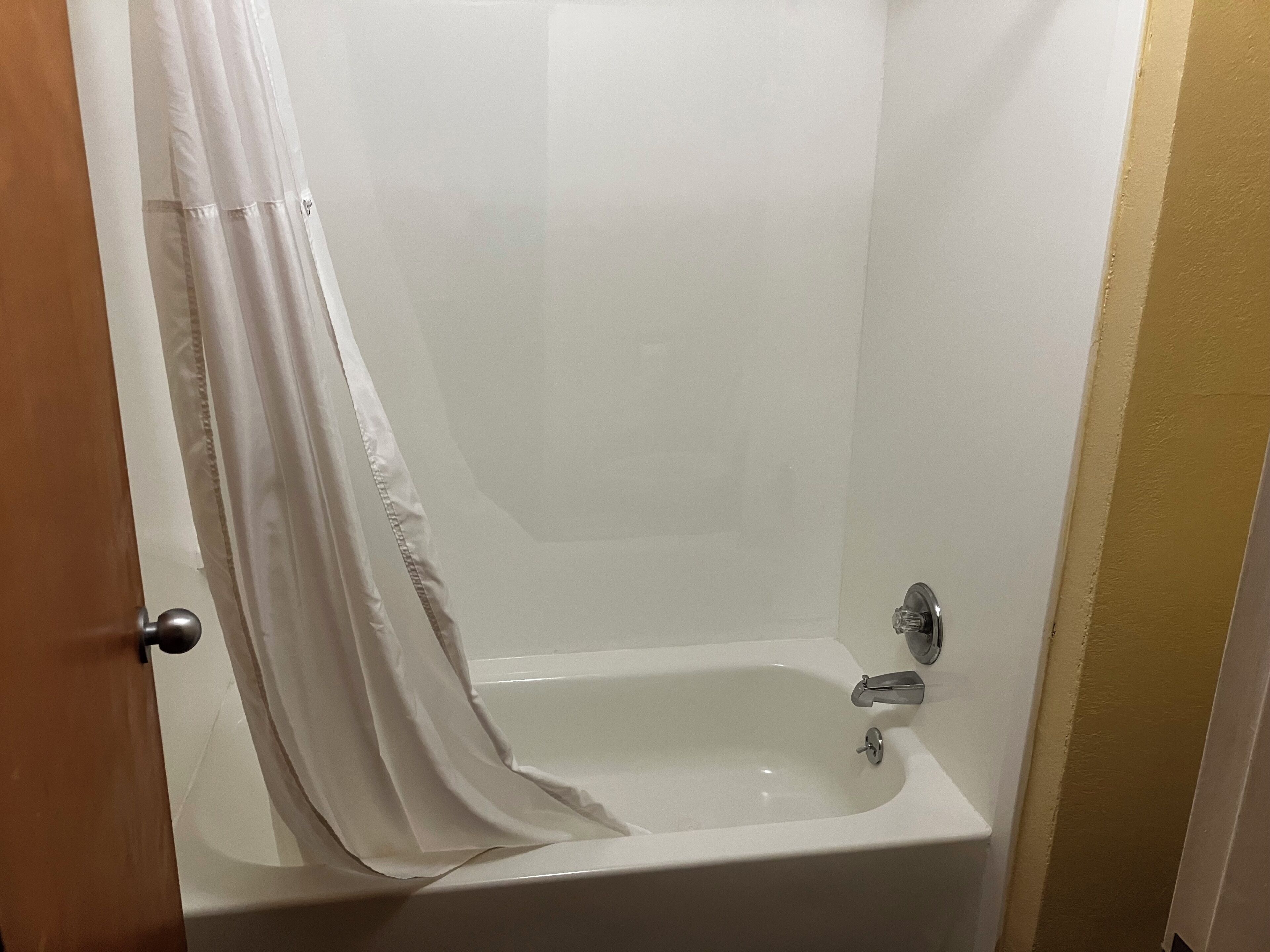Separate tub and shower, hair dryer, towels, soap