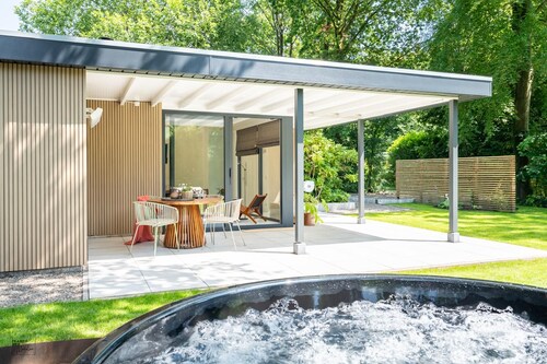 Experience the ultimate vacation feeling in this secluded vacation home with a private wellness area, wood-burning stove, designer interior, and air conditioning