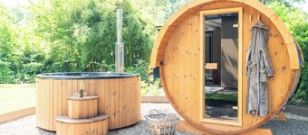 Experience the ultimate vacation feeling in this secluded vacation home with a private wellness area, wood-burning stove, designer interior, and air conditioning