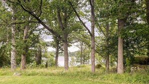 A natural landscape with trees and a body of water in the background. - 3 bedroom stunning home in Linköping (Linköping)