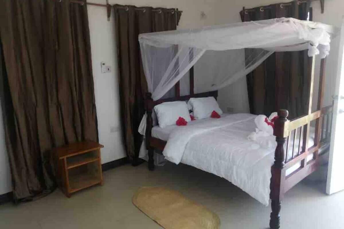 Habitación doble clásica, vista al océano | Wifi gratis, muebles diferentes y ropa de cama