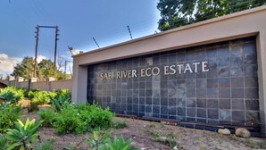 A gated entrance with a sign reading 'SABI RIVER ECO ESTATE.' - Khaya Elihle Guest House (Sabi River Eco Estate)