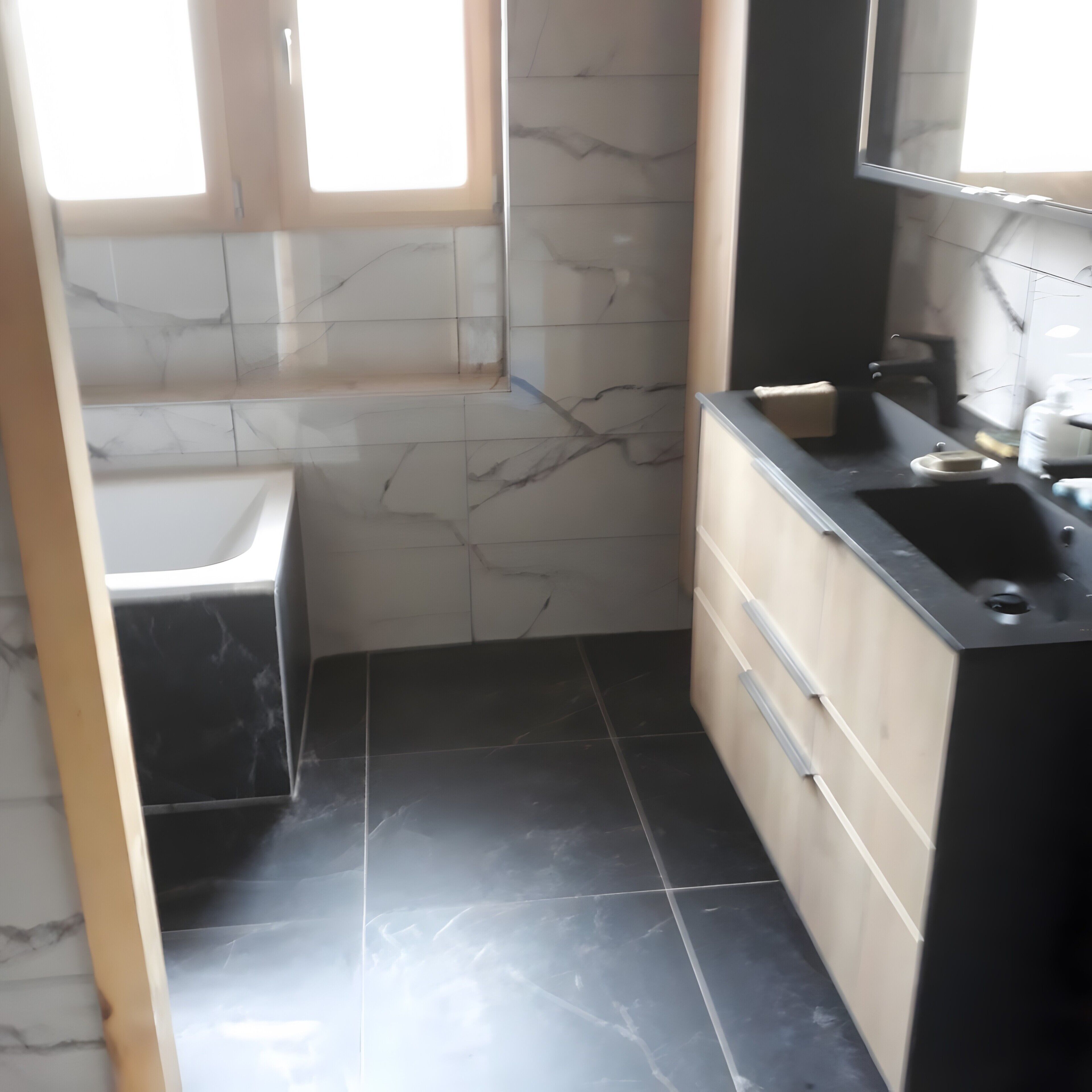 A bathroom with a bathtub, a sink, and a mirror.