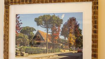 A framed picture of a building with a distinct roof and a sign that reads 'ABBEY MESSIA'.