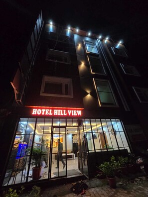 A hotel entrance with a sign reading 'HOTEL HILL VIEW' and a glass door entrance. - Hill View Haridwar Run by R.K. Group (Haridwar)