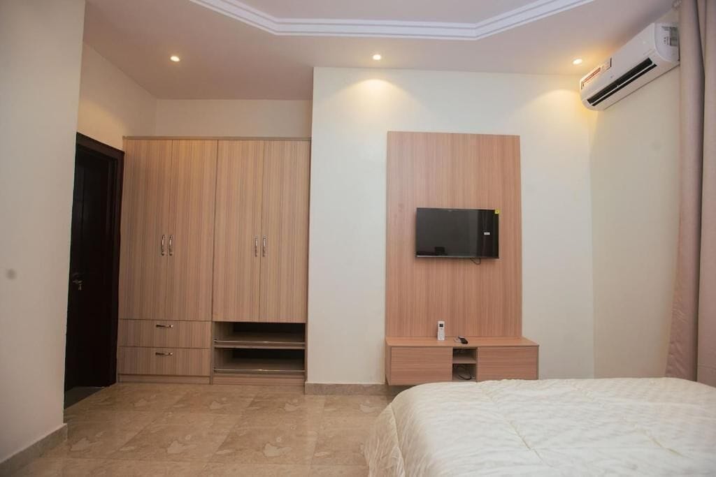 Family Apartment, Balcony, City View | In-room safe, desk, laptop workspace, blackout curtains